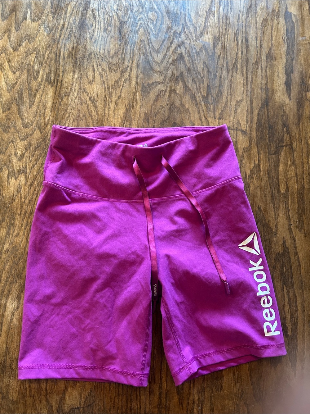 Reebok Women's Magenta Athletic Drawstring Shorts with White Logo